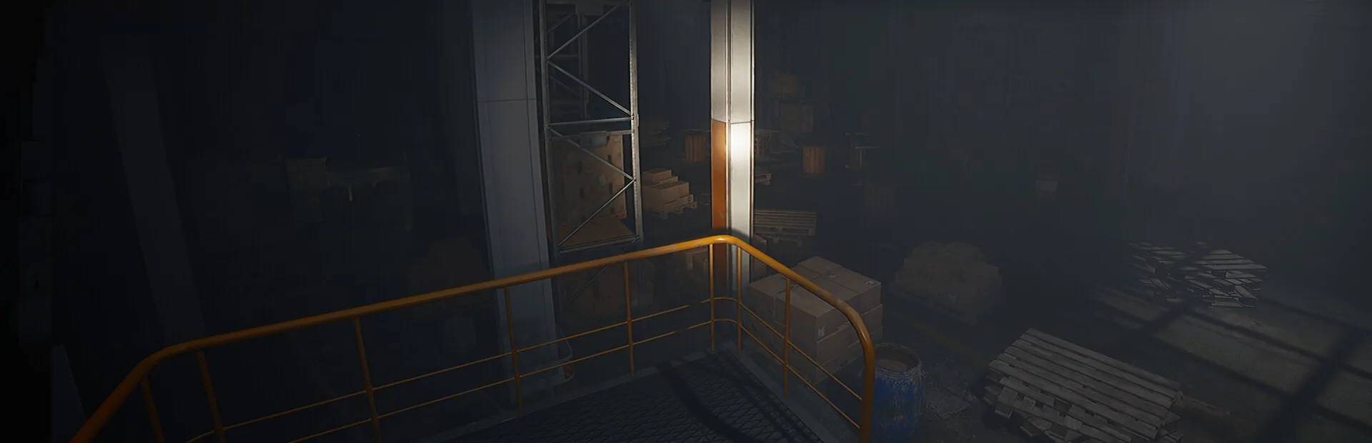 Dark industrial hall with an orange railing